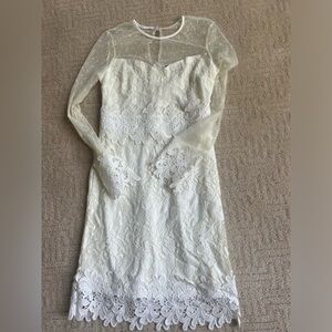 Long sleeve white dress, used for a church wedding ceremony